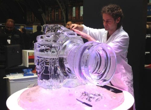 Glacial Art sculptor completing camera ice sculpture